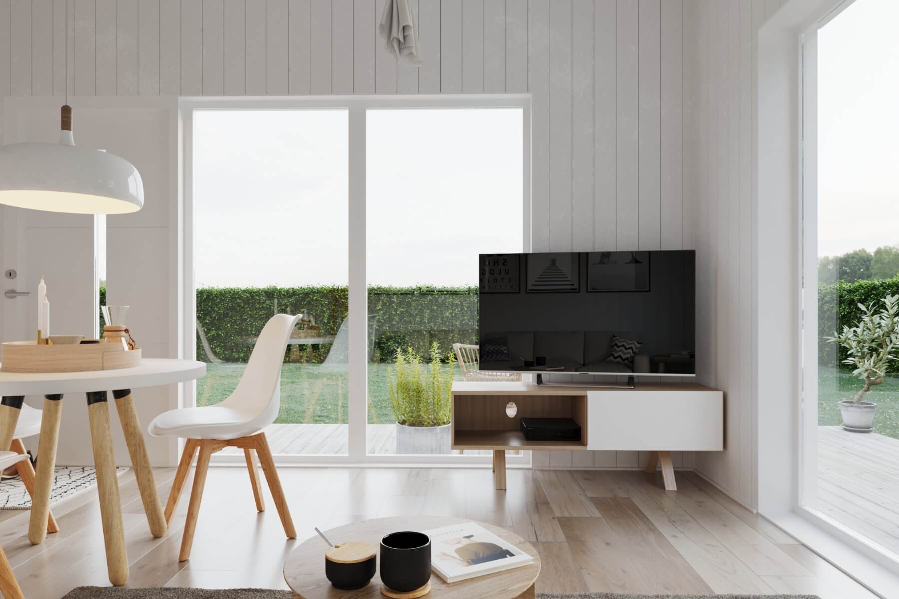 Klassisk Panorama 30.3P 26 Vardagsrum i attefallshus med tv stående på tv-bänk och vackra panoramafönster